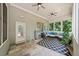 Enclosed screened porch with slate floors, a seating area, ceiling fans and lots of natural light at 1323 Frey Lake Ct, Kennesaw, GA 30144