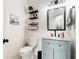 Charming bathroom featuring a blue vanity and modern black fixtures at 1611 Hillside Bend Xing, Lawrenceville, GA 30043