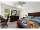 Bedroom with a ceiling fan, dresser, and sporty decor at 1611 Hillside Bend Xing, Lawrenceville, GA 30043