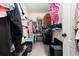 A walk-in closet with ample shelving, racks, and plenty of storage space at 1611 Hillside Bend Xing, Lawrenceville, GA 30043