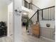 Inviting entry hall with staircase, light-colored floors, and decorative touches at 1611 Hillside Bend Xing, Lawrenceville, GA 30043