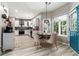 Eat-in kitchen with natural light coming through the windows at 1611 Hillside Bend Xing, Lawrenceville, GA 30043