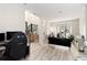 Spacious open-concept living room with modern decor, light floors, and abundant natural light at 1611 Hillside Bend Xing, Lawrenceville, GA 30043