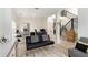 Open living space with light wood floors, stairs, and plenty of natural light at 1611 Hillside Bend Xing, Lawrenceville, GA 30043