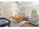 Bright main bedroom featuring a trey ceiling, ceiling fan, and hardwood floors at 1611 Hillside Bend Xing, Lawrenceville, GA 30043