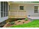 Backyard featuring a small deck and lush green landscaping at 3332 Saint John Dr, East Point, GA 30344
