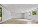 Unfinished basement featuring a window and a door to the outside at 3332 Saint John Dr, East Point, GA 30344