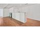 Finished basement with wood flooring, brick bar, and white wood-paneled walls at 3332 Saint John Dr, East Point, GA 30344