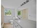 Bathroom featuring white vanity, large mirror, and natural light from window at 3332 Saint John Dr, East Point, GA 30344