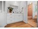 Bathroom featuring colorful tile flooring and vanity storage at 3332 Saint John Dr, East Point, GA 30344
