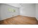 Light and bright bedroom offering neutral paint, ceiling fan, and window to let natural light in at 3332 Saint John Dr, East Point, GA 30344