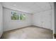 Bedroom with a window overlooking the trees and carpeted floors at 3332 Saint John Dr, East Point, GA 30344