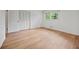 Bedroom showcasing beautiful wood-look flooring, bright white walls and a bifold door closet at 3332 Saint John Dr, East Point, GA 30344