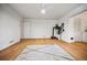 Bedroom with hardwood floors, a ceiling fan, a view of the outdoors, and a decorative rug at 3332 Saint John Dr, East Point, GA 30344