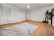 Bedroom with hardwood floors, closet, a view of the outdoors, and a decorative rug at 3332 Saint John Dr, East Point, GA 30344