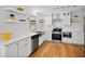 Stylish kitchen with stainless steel appliances, quartz countertops and white shaker cabinets at 3332 Saint John Dr, East Point, GA 30344