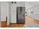 Kitchen space features stainless steel refrigerator, lots of cabinet space, and access to living room at 3332 Saint John Dr, East Point, GA 30344