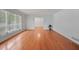 Bright living room with gleaming hardwood floors and natural light streaming through large windows at 3332 Saint John Dr, East Point, GA 30344