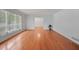 Spacious living room with hardwood floors and large windows providing ample natural light at 3332 Saint John Dr, East Point, GA 30344