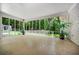 Bright sunroom with expansive windows offering serene views of the surrounding greenery at 3332 Saint John Dr, East Point, GA 30344