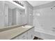 Bathroom boasts vanity sink, and combination tub and shower at 3429 Timbercreek Dr, Lawrenceville, GA 30044