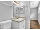 Bright bathroom featuring a vanity with a beige countertop and a double mirrored medicine cabinet at 3429 Timbercreek Dr, Lawrenceville, GA 30044