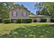 Charming two-story home with a well-manicured lawn and lush landscaping at 3429 Timbercreek Dr, Lawrenceville, GA 30044