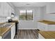 Well lit kitchen features stainless appliances, wood countertop, and modern backsplash at 3429 Timbercreek Dr, Lawrenceville, GA 30044