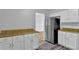 Bright kitchen features white cabinets, laminate countertops, and stainless steel appliances at 3429 Timbercreek Dr, Lawrenceville, GA 30044