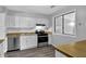 Bright kitchen features white cabinets, laminate countertops, and stainless steel appliances at 3429 Timbercreek Dr, Lawrenceville, GA 30044