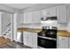 Bright kitchen features white cabinets, laminate countertops, and stainless steel appliances at 3429 Timbercreek Dr, Lawrenceville, GA 30044