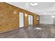 Spacious living room with hardwood flooring and featuring unique wood paneling at 3429 Timbercreek Dr, Lawrenceville, GA 30044