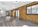 Spacious living room with hardwood flooring and unique wood paneling with natural light at 3429 Timbercreek Dr, Lawrenceville, GA 30044