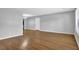 Expansive living room with wood-look flooring, white walls, and a large window for abundant light at 3429 Timbercreek Dr, Lawrenceville, GA 30044