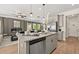 Stylish kitchen island with granite counters and stainless steel dishwasher open to the living room at 84 Ravencliff Dr # 84, Austell, GA 30168