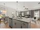 Bright, open kitchen featuring a center island, stainless steel appliances, and modern finishes at 84 Ravencliff Dr # 84, Austell, GA 30168