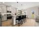 Modern kitchen with granite counters, stainless appliances, and island seating at 84 Ravencliff Dr # 84, Austell, GA 30168