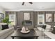 Stylish living room with a modern fireplace, neutral decor, and ample seating at 84 Ravencliff Dr # 84, Austell, GA 30168