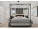 Serene main bedroom showcasing a canopy bed, stylish decor, and ample natural light at 84 Ravencliff Dr # 84, Austell, GA 30168