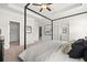Light filled main bedroom with a canopy bed and an open walk-in closet at 84 Ravencliff Dr # 84, Austell, GA 30168
