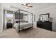 Spacious main bedroom with a tray ceiling, canopy bed, and matching furniture set at 84 Ravencliff Dr # 84, Austell, GA 30168
