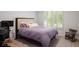 Comfortable bedroom with large window, rocking chair, and desk at 907 Edgewood Ave Ne, Atlanta, GA 30307