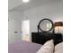 Comfortable bedroom with a mirror above a black dresser at 907 Edgewood Ave Ne, Atlanta, GA 30307