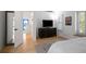 Bright bedroom boasts hardwood floors, TV, and stylish decor at 907 Edgewood Ave Ne, Atlanta, GA 30307