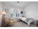 Cozy bedroom with a chair by the window, a single bed, and rug at 907 Edgewood Ave Ne, Atlanta, GA 30307