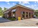 Brick building with large windows, featuring a modern design and well-maintained landscaping at 907 Edgewood Ave Ne, Atlanta, GA 30307
