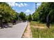 Community path with greenery, leading to residential areas and recreational spaces at 907 Edgewood Ave Ne, Atlanta, GA 30307