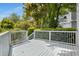 Outdoor deck with white wood railing overlooking lush greenery at 907 Edgewood Ave Ne, Atlanta, GA 30307