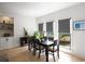 Elegant dining area with a dark wood table and natural light at 907 Edgewood Ave Ne, Atlanta, GA 30307