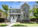 Beautiful front exterior of this home with a covered porch and manicured lawn at 907 Edgewood Ave Ne, Atlanta, GA 30307